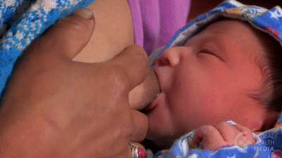 Breastfeeding Mother Pushing Her Nipple GIF