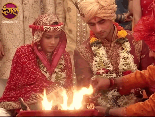 Bride and Groom Before Fire with Dangal TV Logo