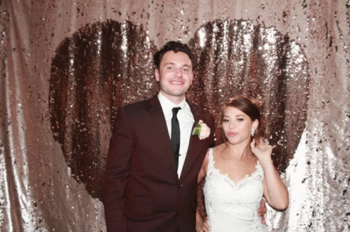Bride And Groom Heart Shaped Sequined Backdrop GIF