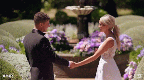 Bride and Groom Holding Hands by Fountain #MAFS