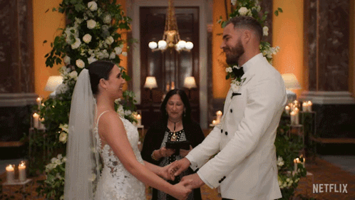 Bride and Groom Holding Hands with Netflix Logo