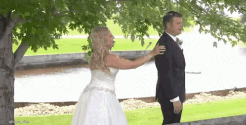 Bride And Groom Hugging Under Tree GIF