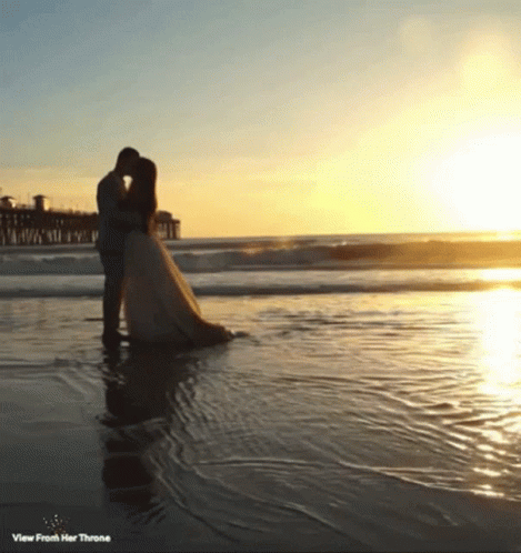 Bride and Groom Kissing Beach View From Her Throne