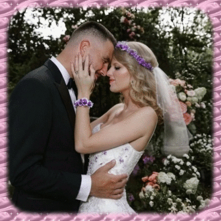 Bride and Groom Kissing in Front of Pink Frame