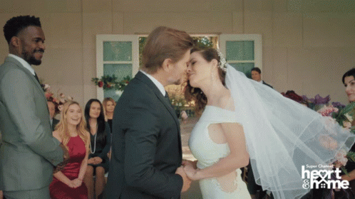 Bride And Groom Kissing With Super Channel Logo GIF