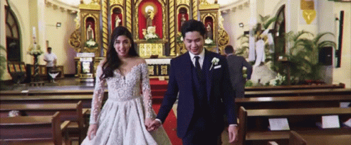 Bride and Groom Walking Down Aisle