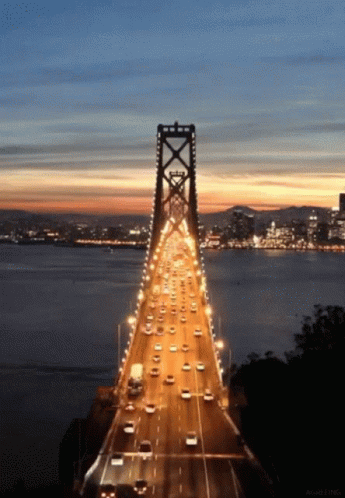 Bridge Over Water At Night GIF