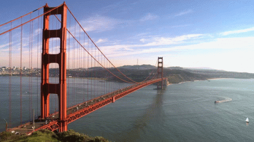 Bridge Over Water With Boat GIF
