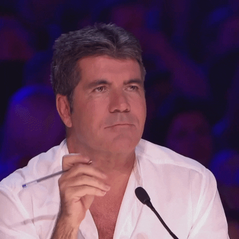 Britains Got Talent Simon Cowell Snickering GIF