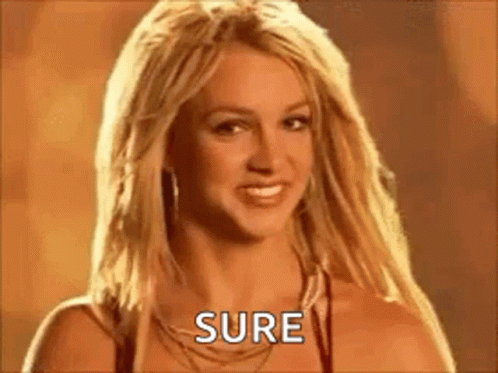 Britney Spears Is Smiling And Looking At The Camera While Wearing A Necklace And Earrings . GIF