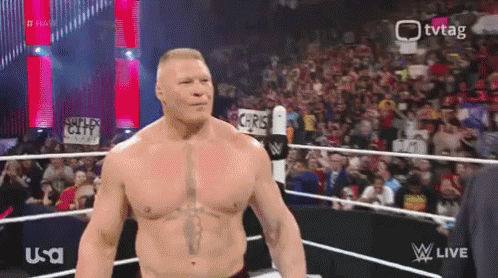 Brock Lesnar Flexing Smile GIF