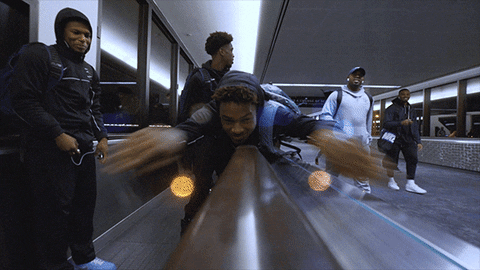 Bronny James Playful Escalator Swim GIF