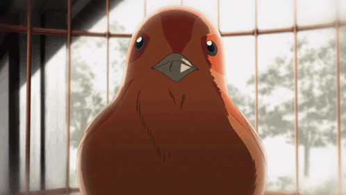 Brown Bird With Black Beak Sitting in Cage Looking at Camera