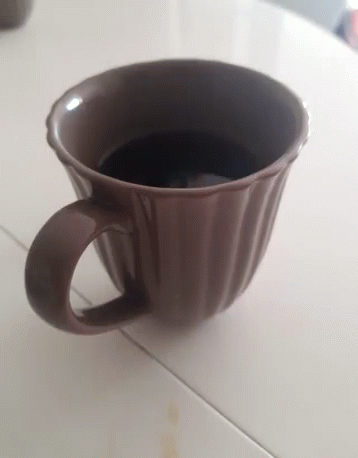 Brown Coffee Cup on Table