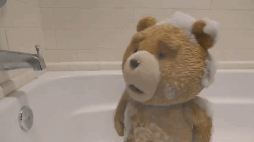 Brown Teddy Bear Taking Bath