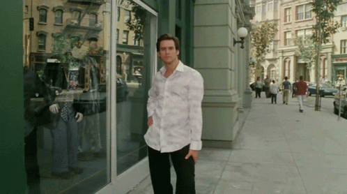 Bruce Almighty Making A Pose On The Street GIF