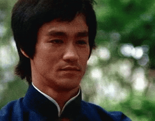 Bruce Lee in Blue Shirt with White Collar