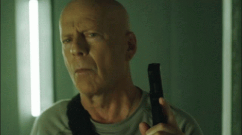 Bruce Willis Holding A Gun GIF