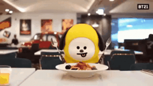 BT21 Stuffed Animal at Table with Food and Sign