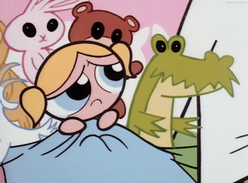 Bubbles From The Powerpuff Girls Is Laying On A Bed GIF