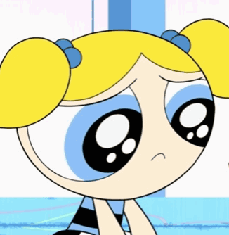 Bubbles From The Powerpuff Girls Is Sitting Down With A Sad Expression On Her Face GIF
