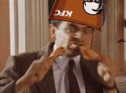 Bucket Of Fried Chicken On Wooden Table GIF