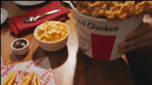 Bucket Of Fried Chicken On Wooden Table GIF