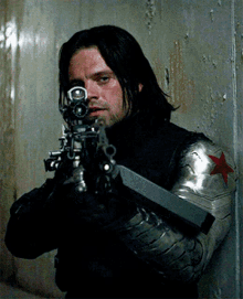 Bucky Putting His Gun Down GIF
