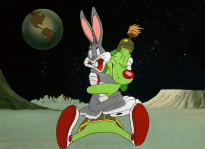 Bugs Bunny And Marvin The Martian Are Hugging In A Cartoon GIF