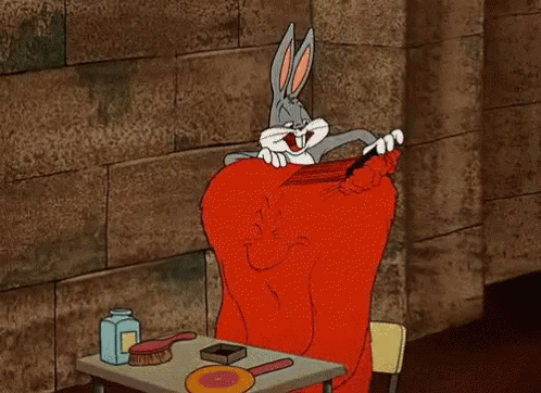 Bugs Bunny Brushing Hair At Table With Brushes And Lotion GIF