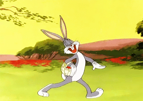 Bugs Bunny From The Looney Tunes Cartoon Is Holding An Easter Egg GIF