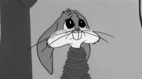 Bugs Bunny Is Crying In A Black And White Cartoon While Holding A Spring . GIF