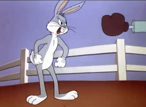 Bugs Bunny Is In A Boxing Ring With A Boxing Glove GIF