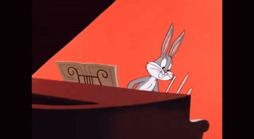 Bugs Bunny Is Playing A Piano With A Sheet Of Music GIF