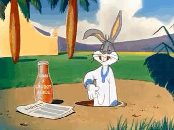 Bugs Bunny Is Sticking His Head Out Of A Hole In The Ground Next To A Bottle Of Carrot Juice . GIF