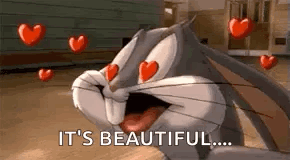 Bugs Bunny Is Surrounded By Hearts And Says `` It 'S Beautiful ... '' . GIF
