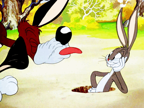 Bugs Bunny Laying On Ground With Tongue Out GIF