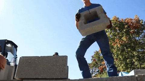 Build The Wall Lifting Concrete Blocks GIF