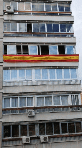 Building With Red and Yellow Flag