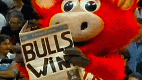 Bull Mascot Holding Bulls Win Newspaper GIF