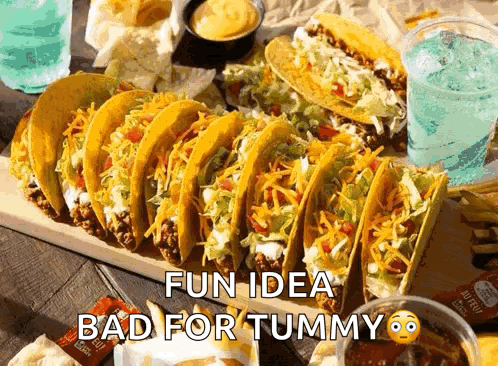 Bunch of Tacos on Wooden Cutting Board