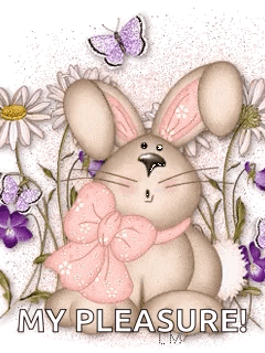 Bunny With Pink Bow Sitting in Flowers