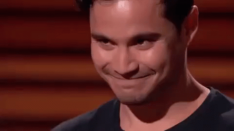 Business Owner Smiles At Sharks On Shark Tank GIF