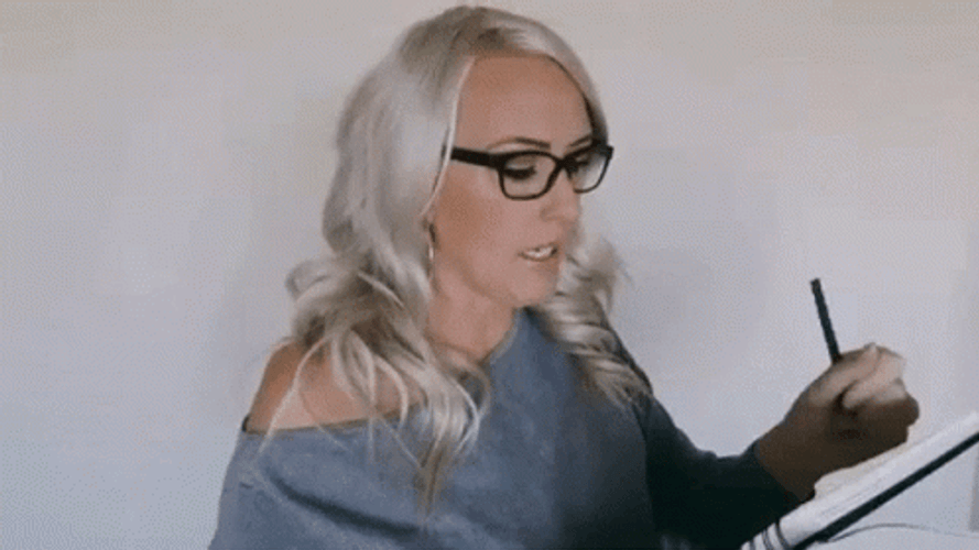Busy Woman Taking Notes GIF