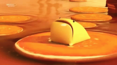 Butter Stirred in Frying Pan With Red Spatula