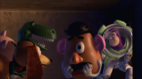 Buzz Lightyear And Mr Potato Head From Toy Story Are Standing Next To Each Other GIF