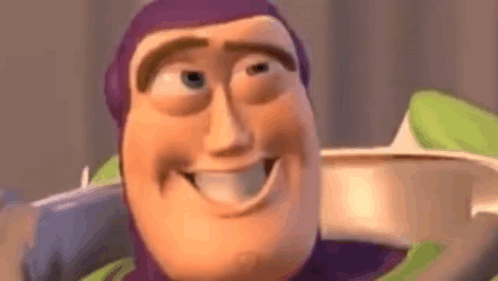 Buzz Lightyear From Toy Story Is Smiling And Looking At The Camera In A Close Up Of His Face . GIF