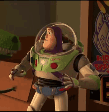 Buzz Lightyear From Toy Story Is Standing In A Room With His Arms Crossed GIF