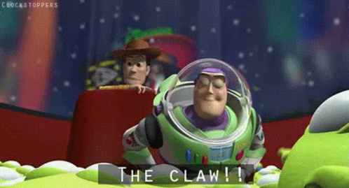 Buzz Lightyear From Toy Story Says The Claw While Woody Looks On GIF