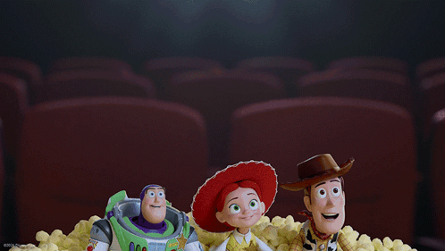 Buzz Lightyear Jessie And Woody From Toy Story Are Sitting In A Pile Of Popcorn GIF